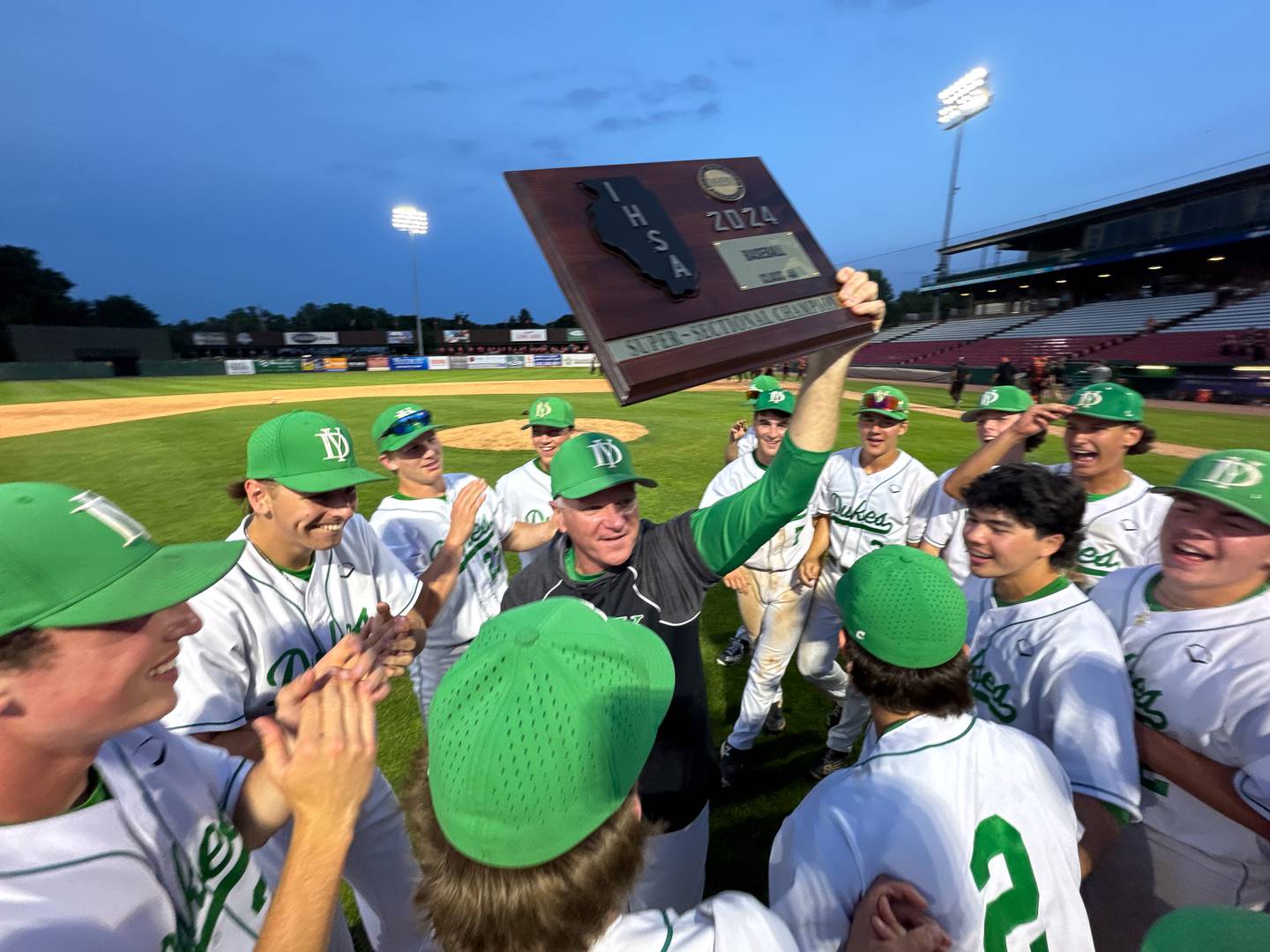 York celebrates their victory over McHenry to win the class 4A Kane County supersectional at Northwestern Medicine Field in Geneva on Monday, June 3, 2024.