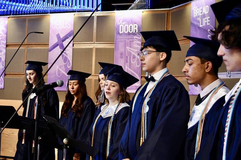 Nazareth Academy graduate Ava Bucur and the senior choir lead the class in song during the school’s commencement ceremony at Christ Church in Oak Brook on Sunday, May 19, 2024.