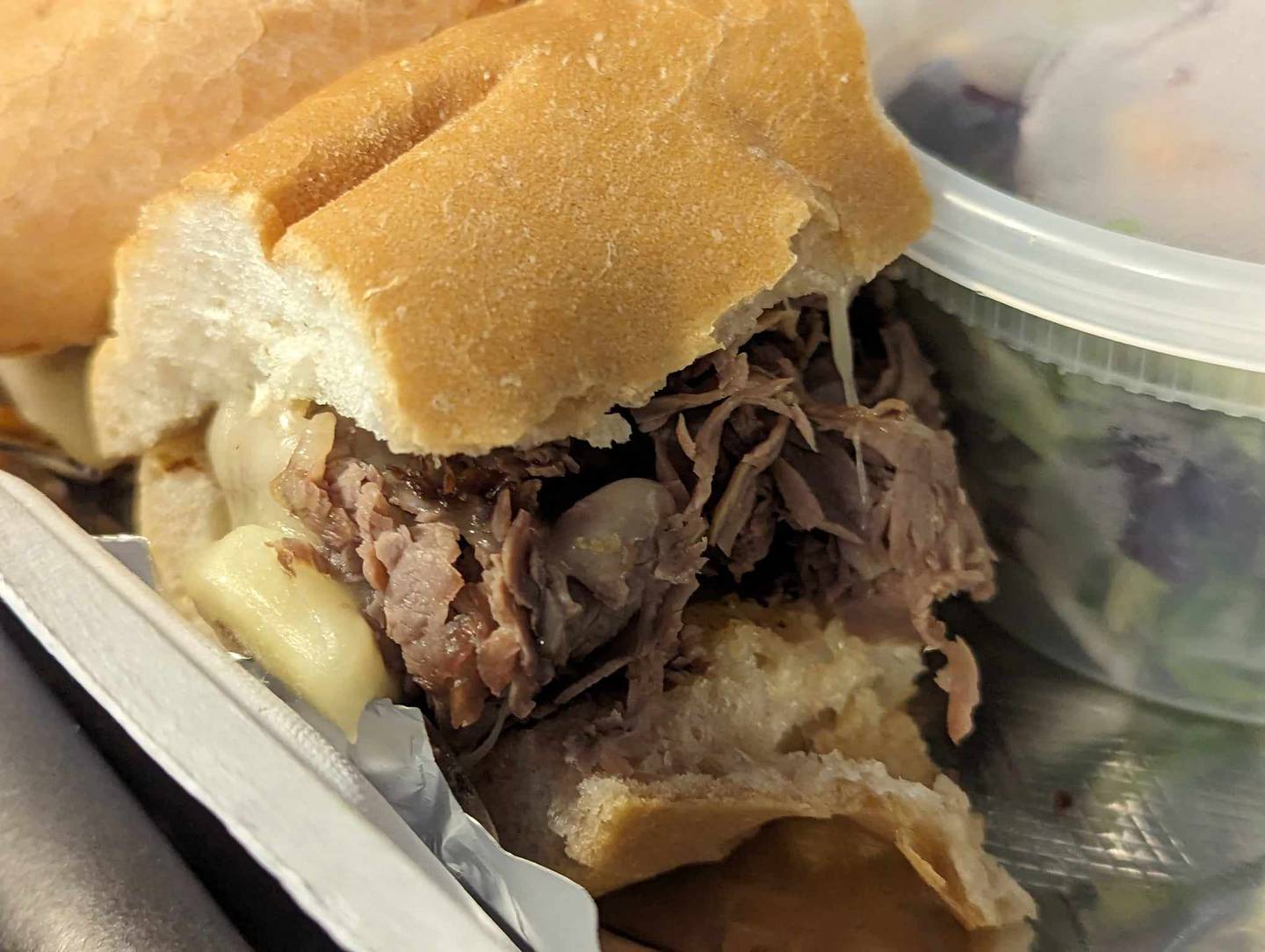 The cheese on Another Piece of Meat sandwich at Freedom Brothers Pizzeria and Alehouse in Plainfield was melted throughout the Italian beef instead of just on top.