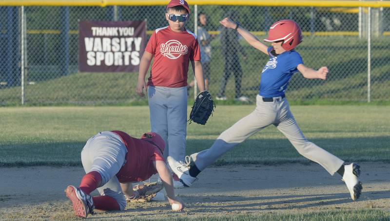 Streator Collision shortstop Noah Rodriguez dives to touch the second-base bag with his glove to force out Hatzer & Son baserunner Patrick Luckey in the second inning Wednesday, June 26, 2024, during the Streator Major Division city championship game.