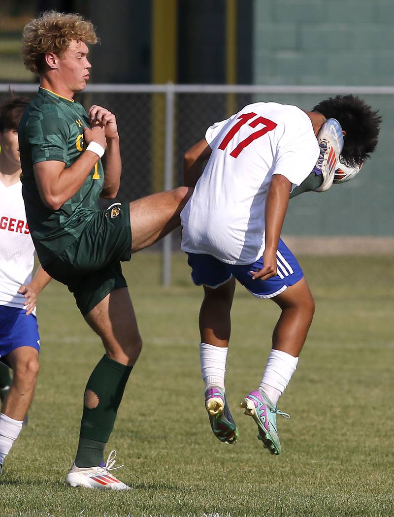 Crystal Lake South's Mason Ross kicks Dundee-Crown's Jesus Caballero as he tries to kick the ball during a Fox Valley Conference soccer match on Tuesday, Sept. 10, 2024, at Crystal Lake South High School.