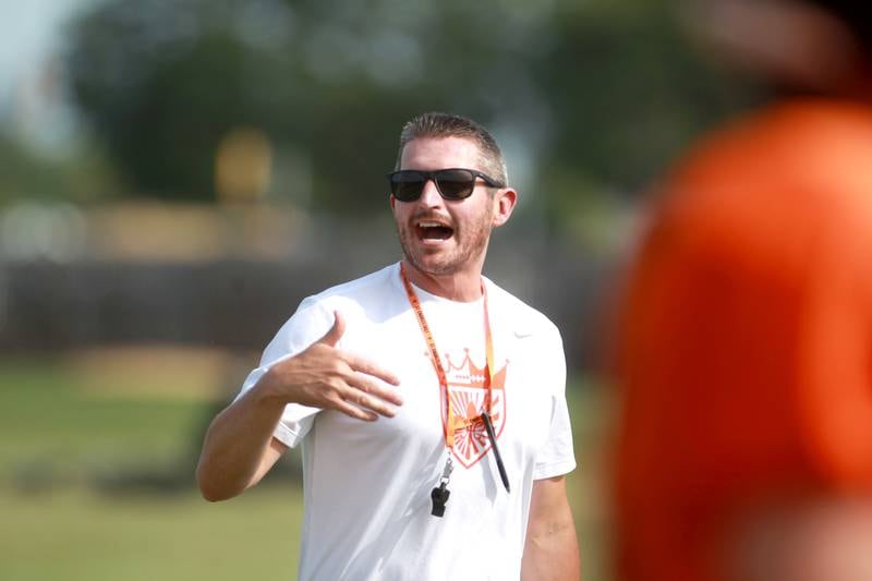 St. Charles East Head Coach Nolan Possley talks to his team during a practice on Thursday, Aug. 22, 2024 in St. Charles.