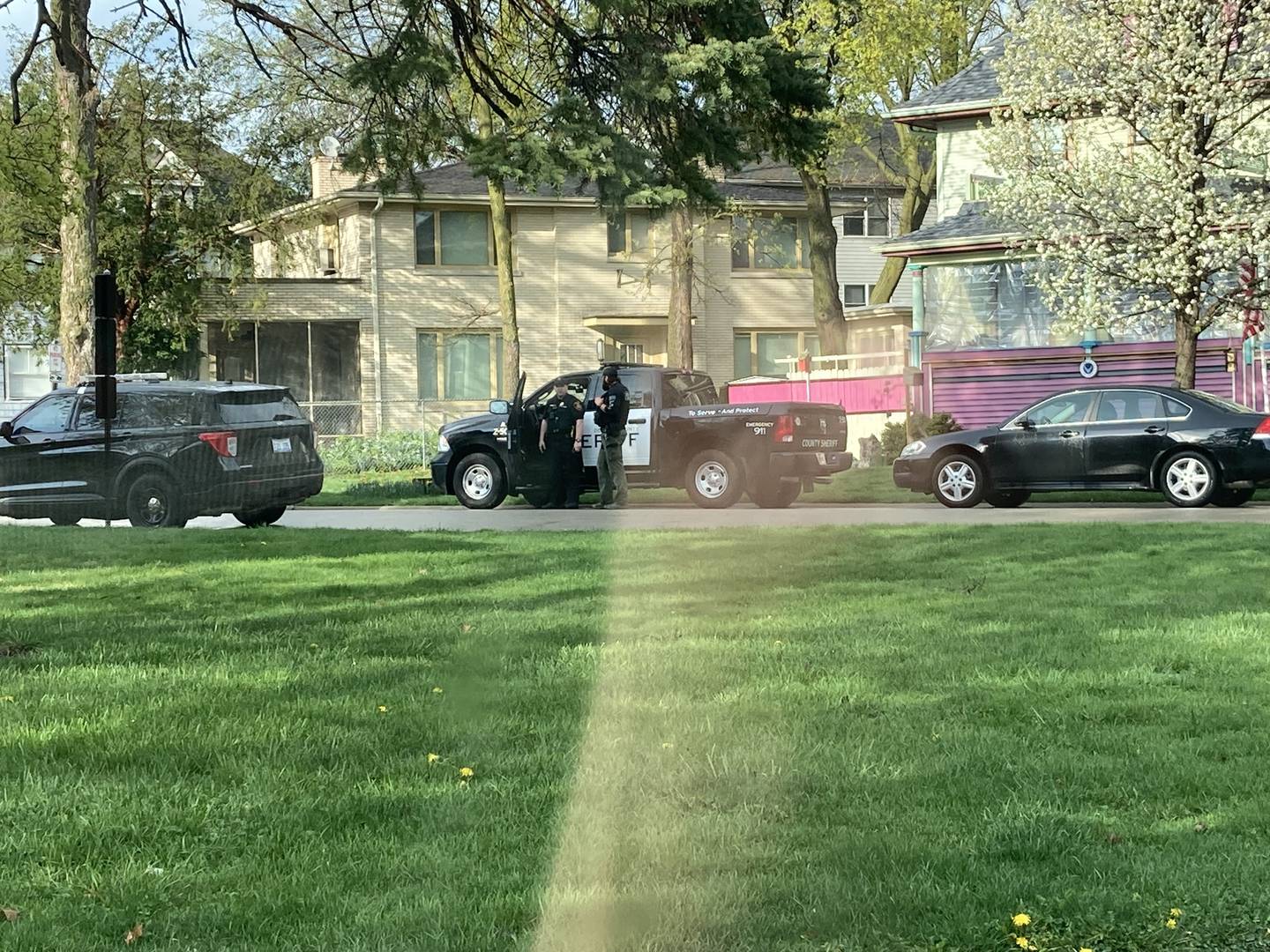 DeKalb police officers can be seen searching a home in the 200 block of College Avenue, DeKalb, around 5 p.m. Thursday, April 20, 2023. Police arrested two men at the residence. One of them is accused of robbing of a Vinny's Pizza delivery person earlier that day.