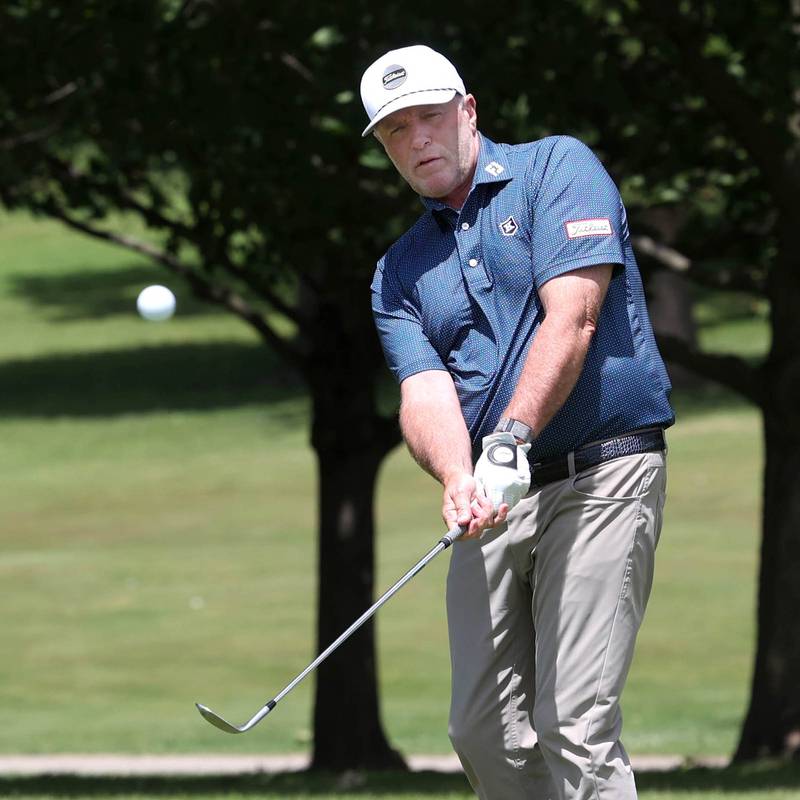 David Paeglow, head golf pro at Kishwaukee Country Club, chips onto the 18th green Thursday, June 6, 2024, at the country club in DeKalb. Paeglow will compete in the U.S. Senior Open later this month.