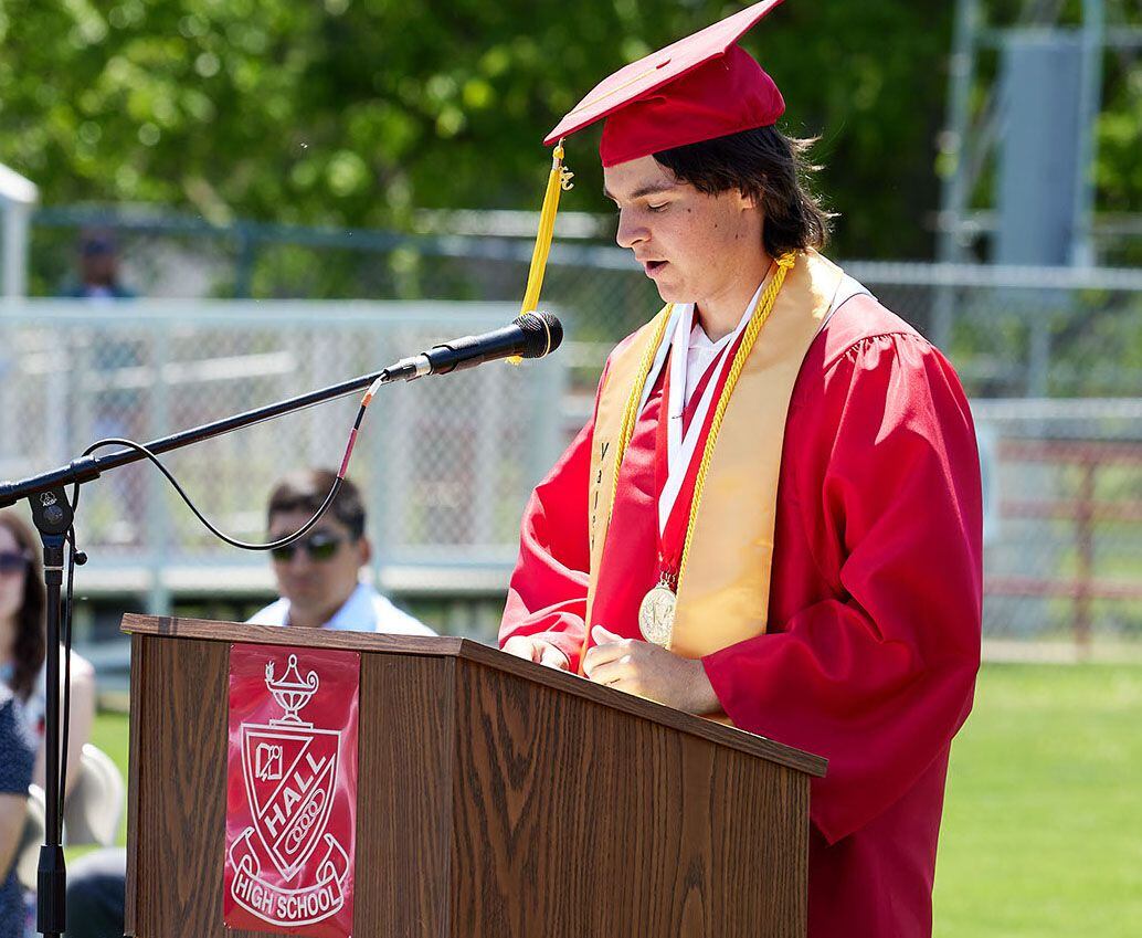 Hall High School valedictorian Kyler Lapp gives a speech during the Class of 2023 graduation ceremony on Sunday, May 21, 2023, outdoors at the high school.