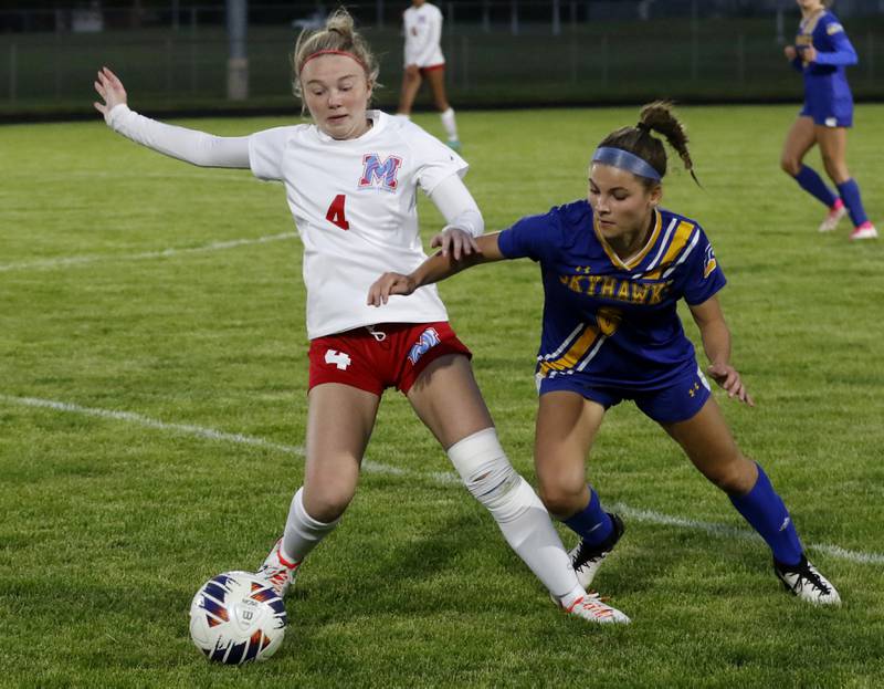 Marian Central'a Greta Fortin battles with Johnsburg's Elizabeth Smith for control of the ball during the IHSA Class 1A Marengo Regional championship soccer match on Tuesday, May 14, 2024, at Marengo High School.