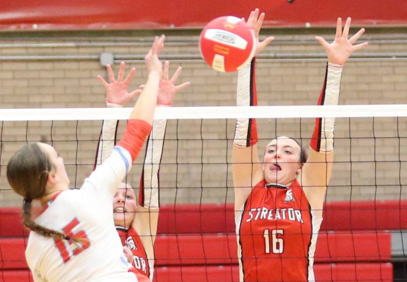 Ottawa's Addison Duggan sends a kill past Streator's Emma Rambo and teammate Sophia Snow on Thursday, Aug. 29, 2024 in Kingman Gym at Ottawa High School.