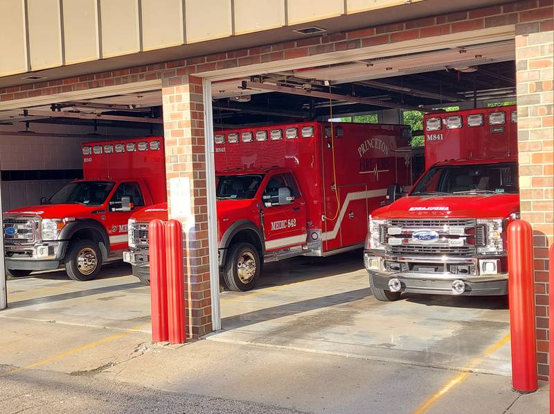 The fleet of ambulances sits in the Princeton Fire Department garage, including the city's new ambulance (middle).
