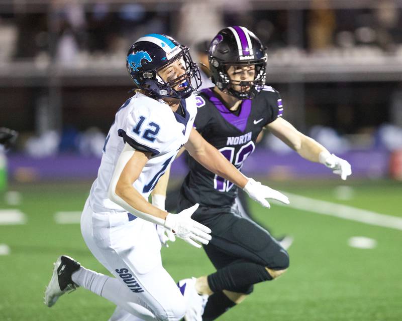 Downers Grove North's Max Troha battles for position against Downers Grove South  on Friday Sept. 6,2024 in Downers Grove.