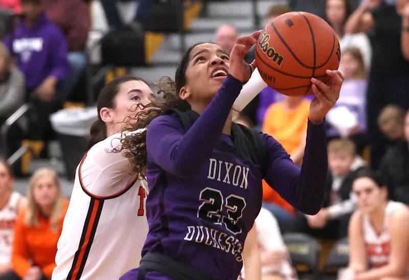 Dixon’s Ahmyrie McGowan gets up a shot in front of Crystal Lake Central's Quin O'Donnell during their Class 3A sectional semifinal Tuesday, Feb. 20, 2024, at Sycamore High School.