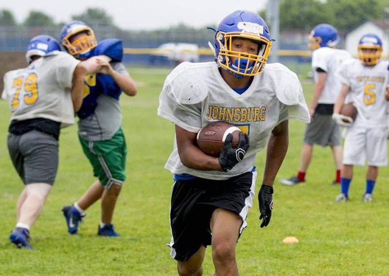 Johnsburg's Alex Peete runs the ball during a practice at Johnsburg High school July 16, 2015.