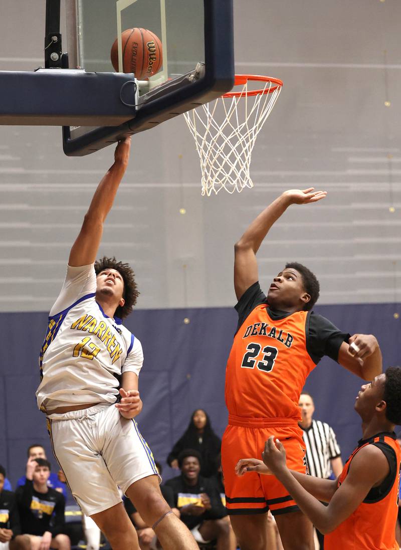 Warren's Alex Daniels gets a layup in front of DeKalb’s Davon Grant Tuesday, Feb. 27, 2024, during their Class 4A sectional semifinal game at Rock Valley College in Rockford.