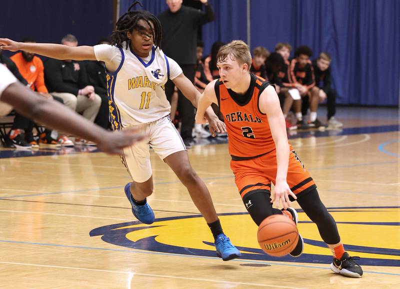 DeKalb’s Sean Reynolds drives by Warren's Braylon Walker Tuesday, Feb. 27, 2024, during their Class 4A sectional semifinal game at Rock Valley College in Rockford.