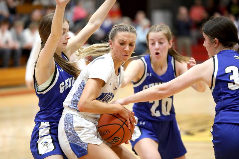 St. Charles North’s Reagan Sipla struggles to hold onto the ball as she’s surrounded by the Geneva defense during a Class 4A Batavia Sectional semifinal game on Tuesday, Feb. 20, 2024.