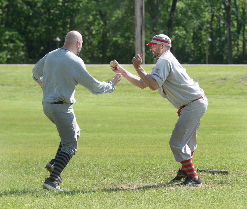Ganymedes' Matt Gecan tags out a Milwaukee runner during the vintage base ball team's  home opener on Saturday, May 18, 2024.