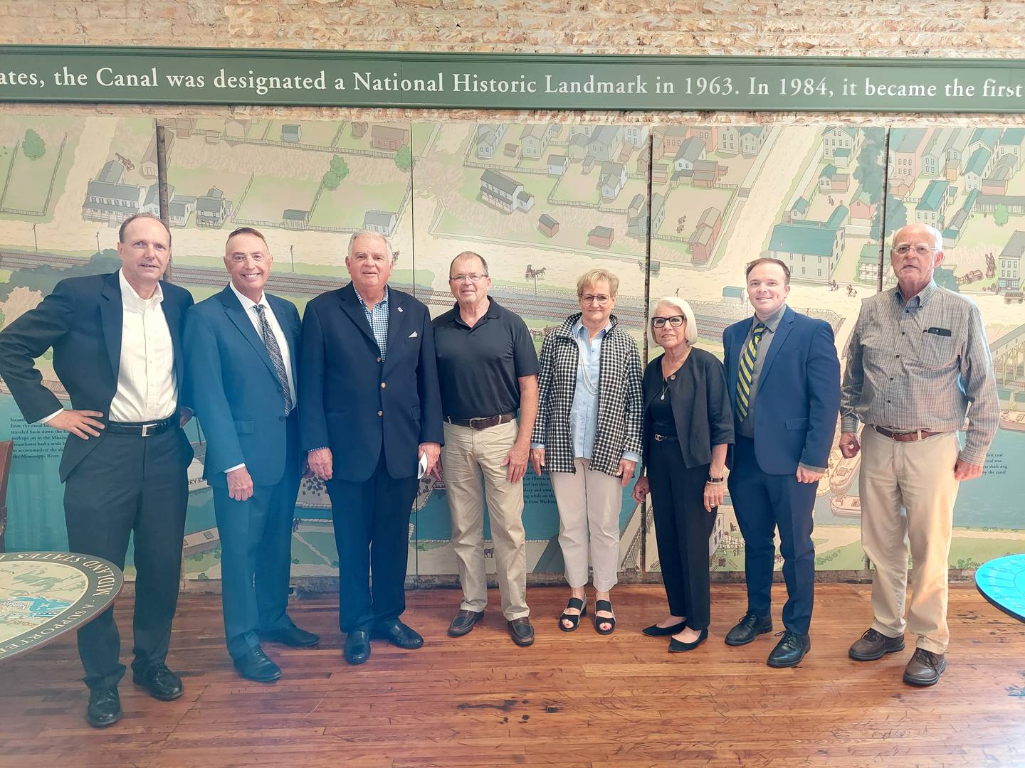 Members of the Canal Trail Connector Inc., (from left) Todd Volker, co-chair Jay McCracken, former U.S. Secretary of Transportation Ray LaHood, co-chair Bob Eschbach, Inga Carus, Nancy Naylor, Dustin Marquis and Jim Nowlan pose for a photo Tuesday, Aug. 22, 2023, in front of an Illinois and Michigan Canal mural at Lock 14 in La Salle. The group's goal is to connect the trails of the Illinois and Michigan Canal and the Hennepin Canal.