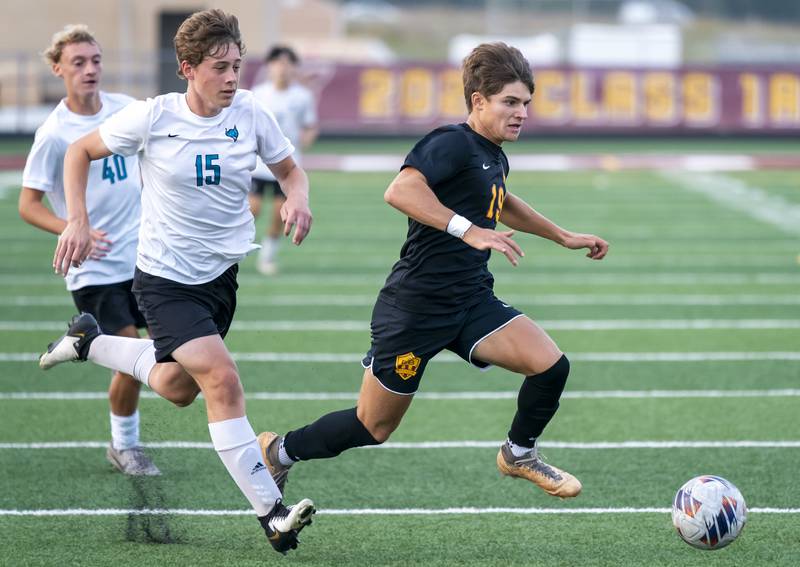 Richmond-Burton's Nick Kyes beats Woodstock North's Andrew Goetz to the ball during their game on Wednesday, September 18, 2024 at Richmond-Burton High School in Richmond.