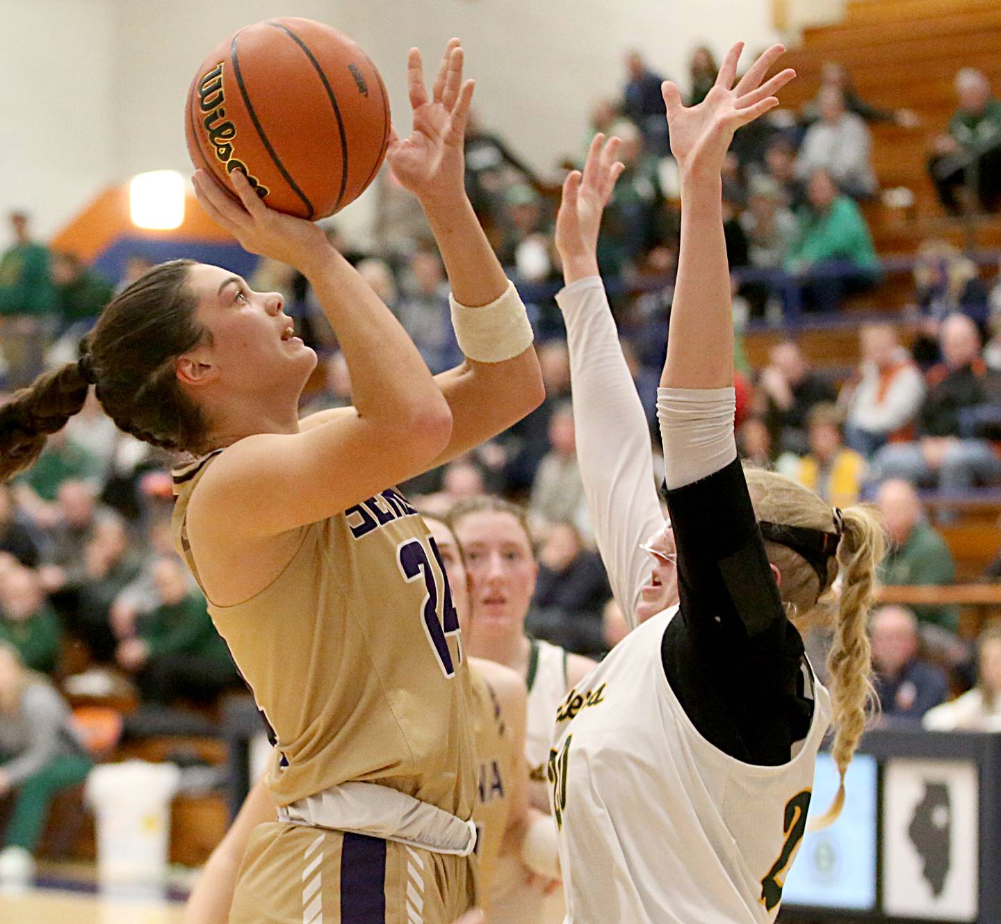 Serena's Paisley Twait (24) shoots over St. Thomas More's Giana Kreps in the Class 1A Pontiac Super-Sectional on Monday, Feb. 27, 2023.