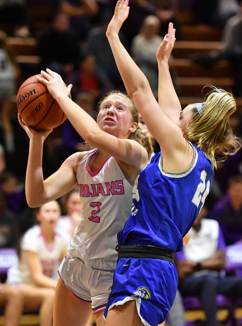 Downers Grove North's Hope Sebek (2) draws a foul from Lyons Township's Kennedy Wanless as she lays the ball up resulting in a three point play during a game on Jan. 30, 2024 at Downers Grove North High School in Downers Grove .