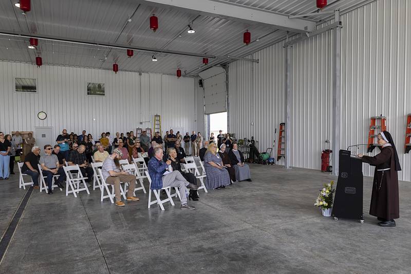 Sister Judith Ann, OSF Health Care board chair, says a few words before a prayer at the new Life Flight hangar Wednesday, July 10, 2024 in Rock Falls.