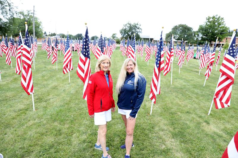 Operation Support Our Troops America Board Member Eugenia Callison (left) and Executive Director Linda Tuisl at the Field of Honor at Denning Park in La Grange in September.
