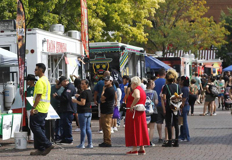 People line up to order food during the annual Hispanic Connections Mexican Independence Day Celebration on Sunday, Sept. 15, 2024, in the Historic Woodstock Square. The celebration featured music, food and culture.