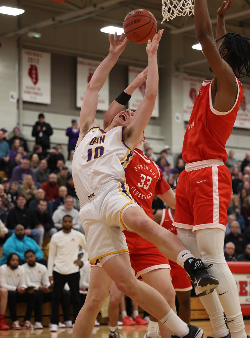 Downers Grove North’s Bobby Grganto (10) throws up a shot against against Homewood-Flossmoor / Downers Grove North during the When Sides Collide Shootout on Saturday, Jan. 20, 2024 in Lisle, IL.