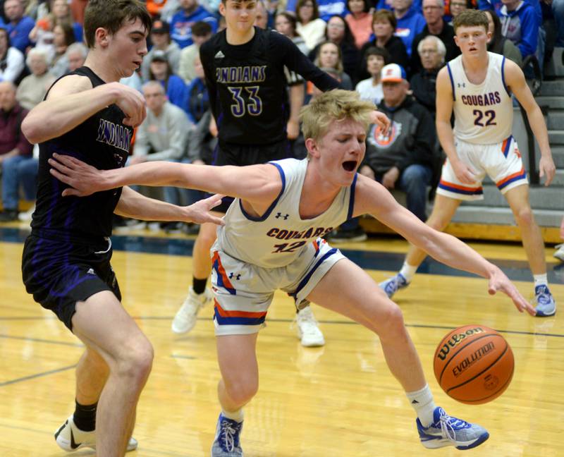 Eastland's Adam Awender (12)draws contact as he drives to the basket against Pecatonica during the championship game of the 1A River Ridge sectional on Friday, March 1, 2024.