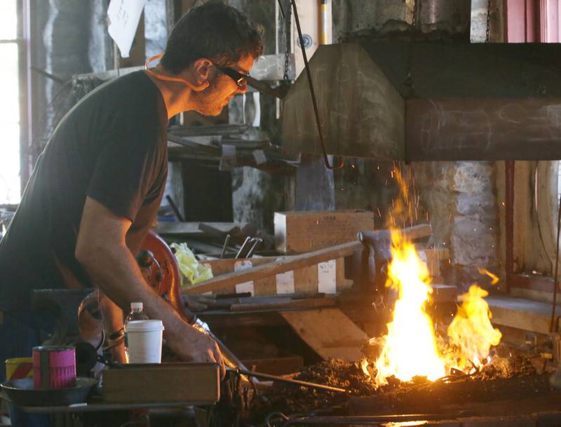 Doug Eichert, melts metal at the La Salle County Historical Blacksmith Shop during the 52nd annual Burgoo on Sunday, Oct. 9, 2022 in Utica.