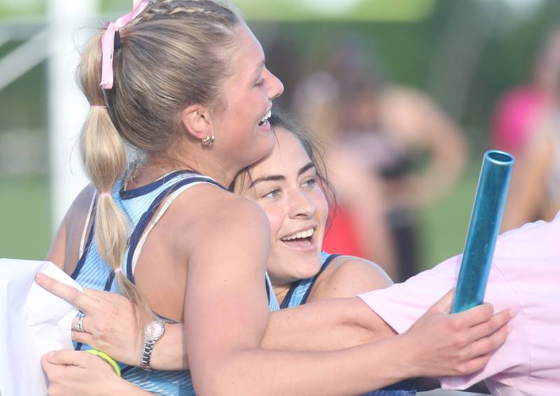 Bureau Valley's McKinley Canady hugs teammate Maddie Wetzell after coming in the 4x100 meter relay during the Class 1A Sectional meet on Wednesday, May 8, 2024 at Bureau Valley High School.