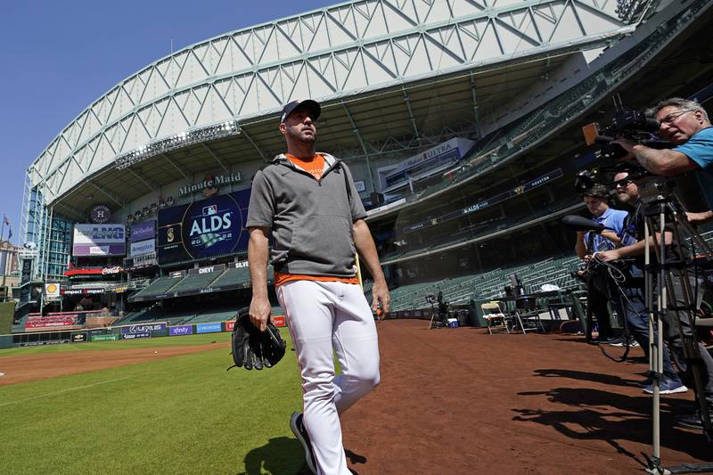 Houston Astros starting pitcher Justin Verlander walks toward the dugout after a workout ahead of Game 1 of baseball's American League Division Series, Monday, Oct. 10, 2022, in Houston. The Astros will play the Seattle Mariners Tuesday. (AP Photo/David J. Phillip)