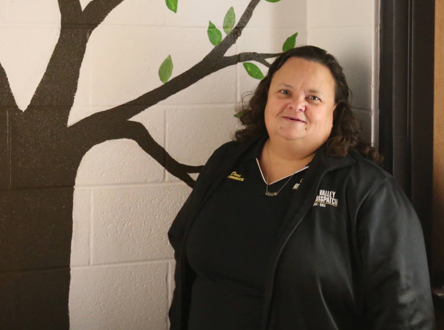 Julie Dean, a dispatcher for the Illinois Valley Regional Dispatch Center, poses for a photo on Monday, April 15, 2024, in Peru.