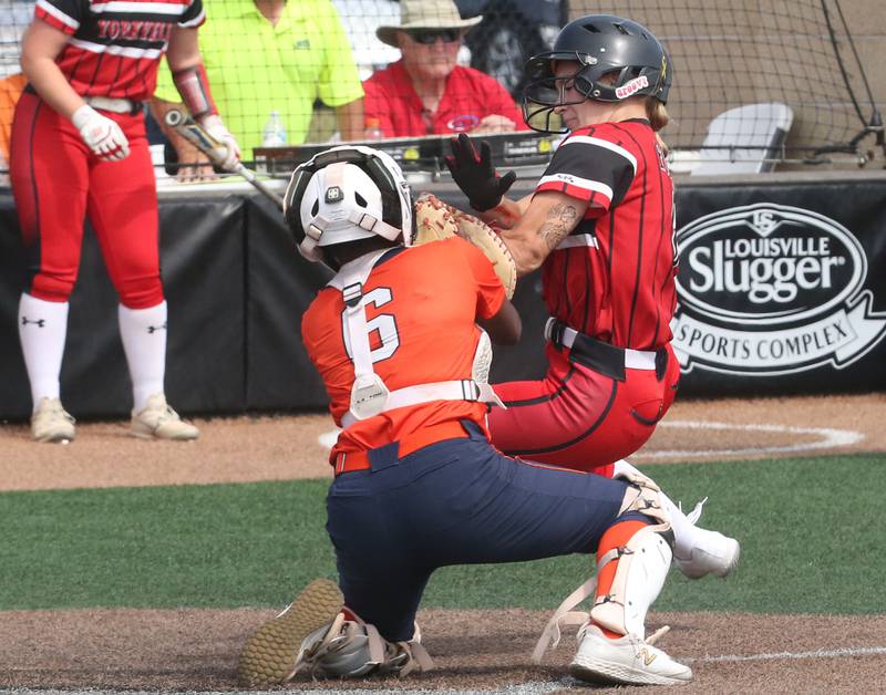 Oak Park-River Forest catcher Tyler Brock tags out Yorkville's Kaitlyn Roberts at the plate during the Class 4A State semifinal softball game on Friday, June 9, 2023 at the Louisville Slugger Sports Complex in Peoria.