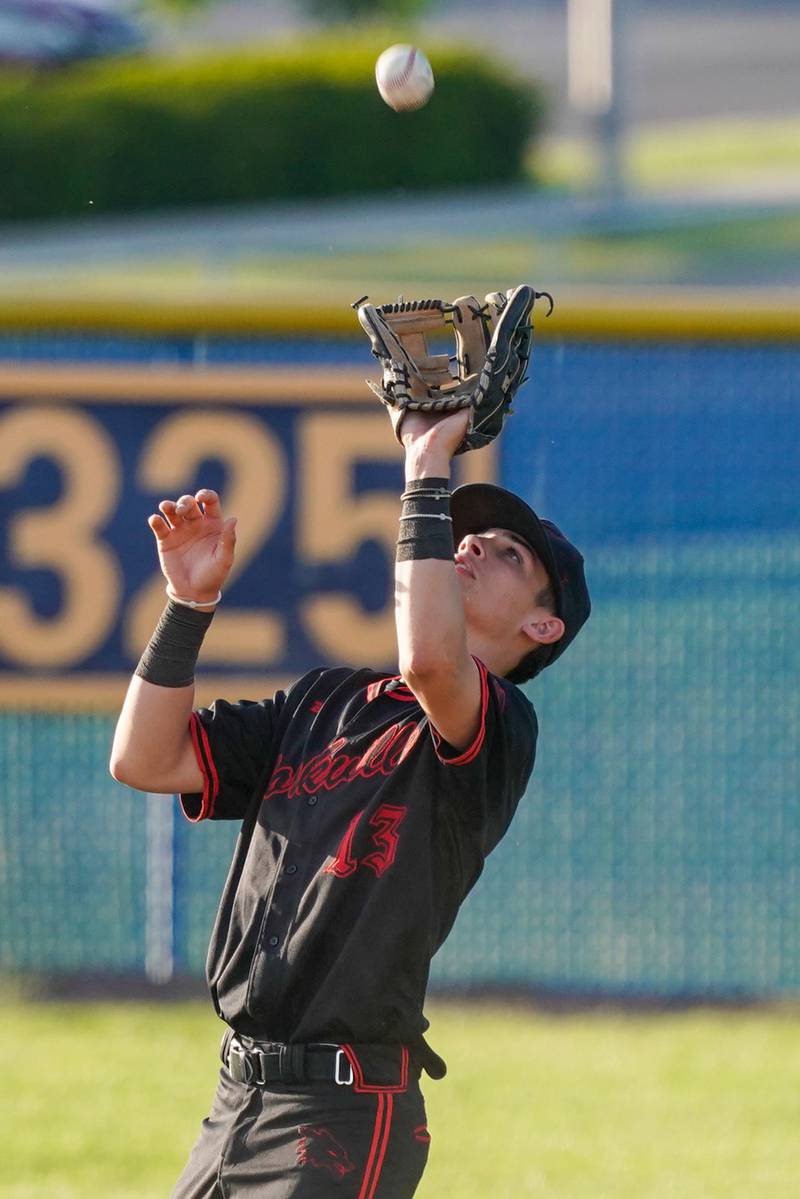 Yorkville's Jackson Roberts (13) catches a fly ball for an out against Neuqua Valley during a Class 4A Neuqua Valley Regional semifinal baseball game at Neuqua Valley High School in Naperville on Thursday, May 23, 2024.