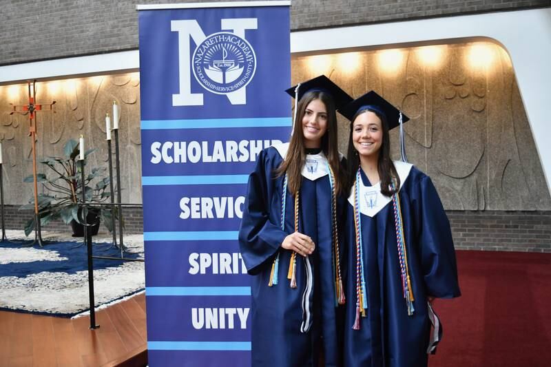 Nazareth Academy graduates Jane McNamara (left) and Neeve Olson (right) during the school’s commencement ceremony at Christ Church in Oak Brook on Sunday, May 19, 2024.