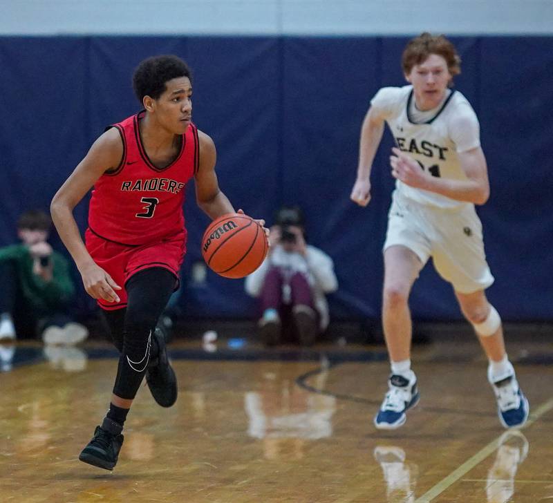 Bolingbrook's Davion Thompson (3) brings the ball up the court against Oswego East during a basketball game at Oswego East High School in Oswego on Wednesday, Jan 10, 2024.