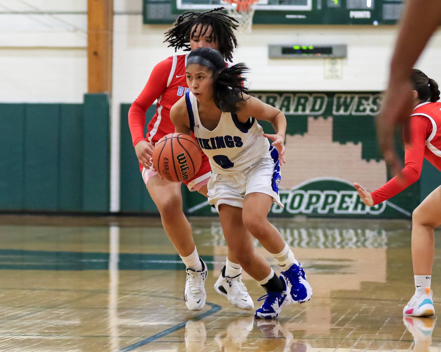 Geneva's Rilee Hasegawa (0) drives to the basket during Class 4A Glenbard West Sectional final game between Geneva at Batavia.  Feb 23, 2023.