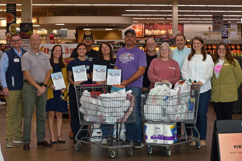 Hometown Hero winners and sponsors pose for a picture. The Hometown Hero Sweepstakes is sponsored by your Peru HyVee, Hometown National Bank, Schweickert, Ganassin, Krzak, and Rundio Injury Attorneys, A Lifetime of Smiles, Schimmer Ford/Hyundai, and Debo Ace Hardware.