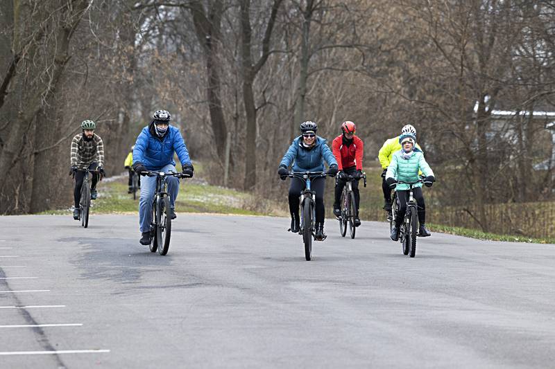 The group heads for the bike path which will lead them to Lowell Park Monday, Jan. 1, 2024.