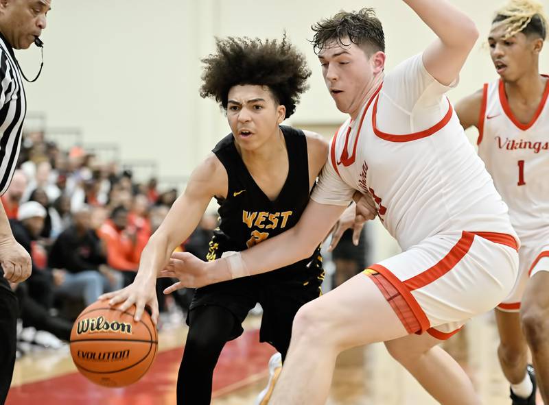 Joliet West's Corey Nobles tries to keep possession of the ball during the Class 4A sectional semifinal against Homewood Flossmoor at Rich Township on Tuesday, Feb. 27, 2024, at Richton Park. (Dean Reid for Shaw Local News Network)