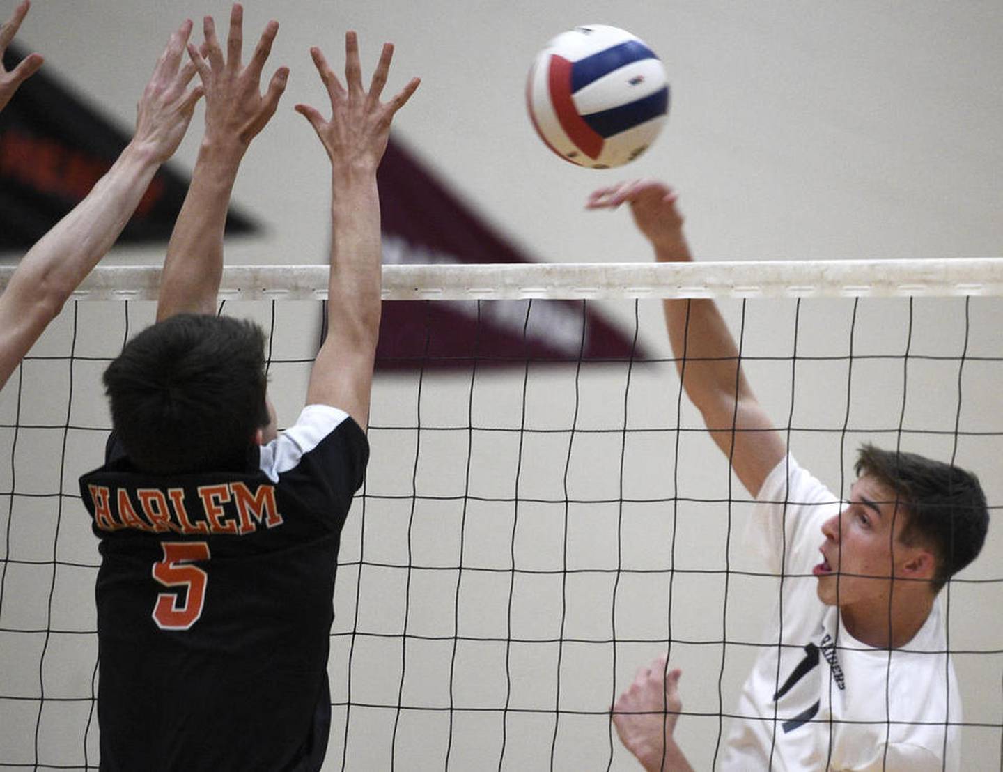 Huntley junior Charlie Johnson hits the ball over the net during a home match Monday, May 1, 2017, against Harlem.