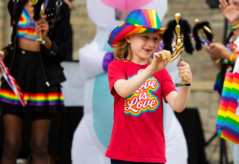 Harrison Modderman, 8, of Downers Grove shows off the award he received after the pride parade during the Downer’s Grove Pride Fest on Saturday, June 8, 2024.

Suzanne Tennant/For Shaw Local News Media