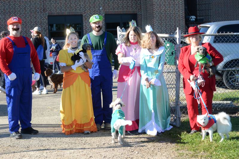 The Joines-Meinert family came dressed as characters from the Mario video game. Pictured are Kevin Manus, Emily Meinert with dog Eden, Sean Meinert, Beth Manus with dog Ginger, Amelia Manus, Paula Joines with dogs Ziggy and Annie. The Meinerts are from Oregon. Manus and Joines are from Tuscola.