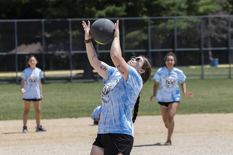 Camp counselor Alex Nelson hauls in a pop fly Thursday, July 20, 2023 during a game of kick ball at Centennial Park.