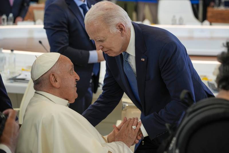 Pope Francis, left, greets U.S. President Joe Biden during a working session on AI, Energy, Africa and Mideast at the G7 summit, in Borgo Egnazia, near Bari in southern Italy, Friday, June 14, 2024. (AP Photo/Andrew Medichini)