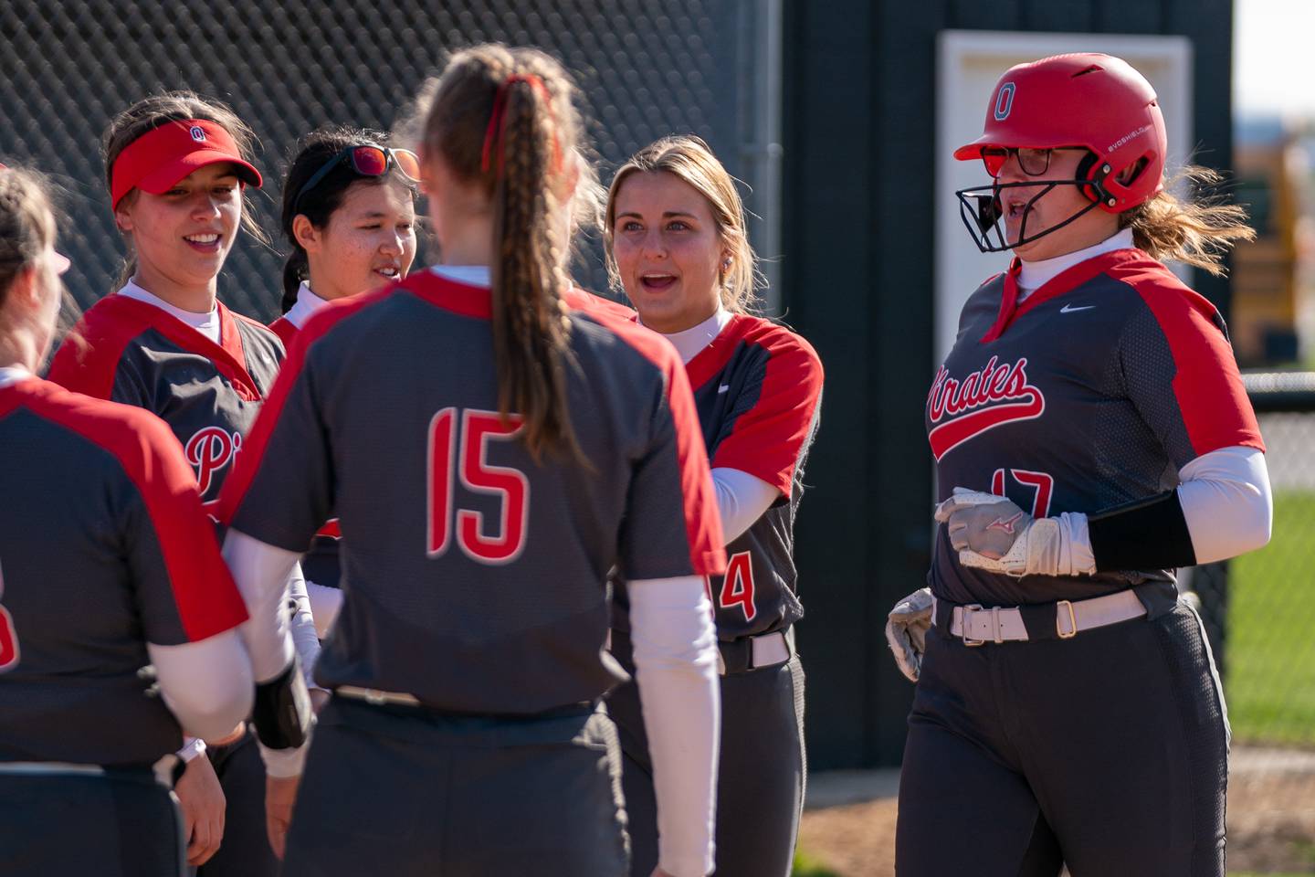 Ottawa’s McKenzie Oslanzi (17) is greeted at home after hitting a homer against Kaneland during a softball game at Kaneland High School on Wednesday, April 26, 2023.