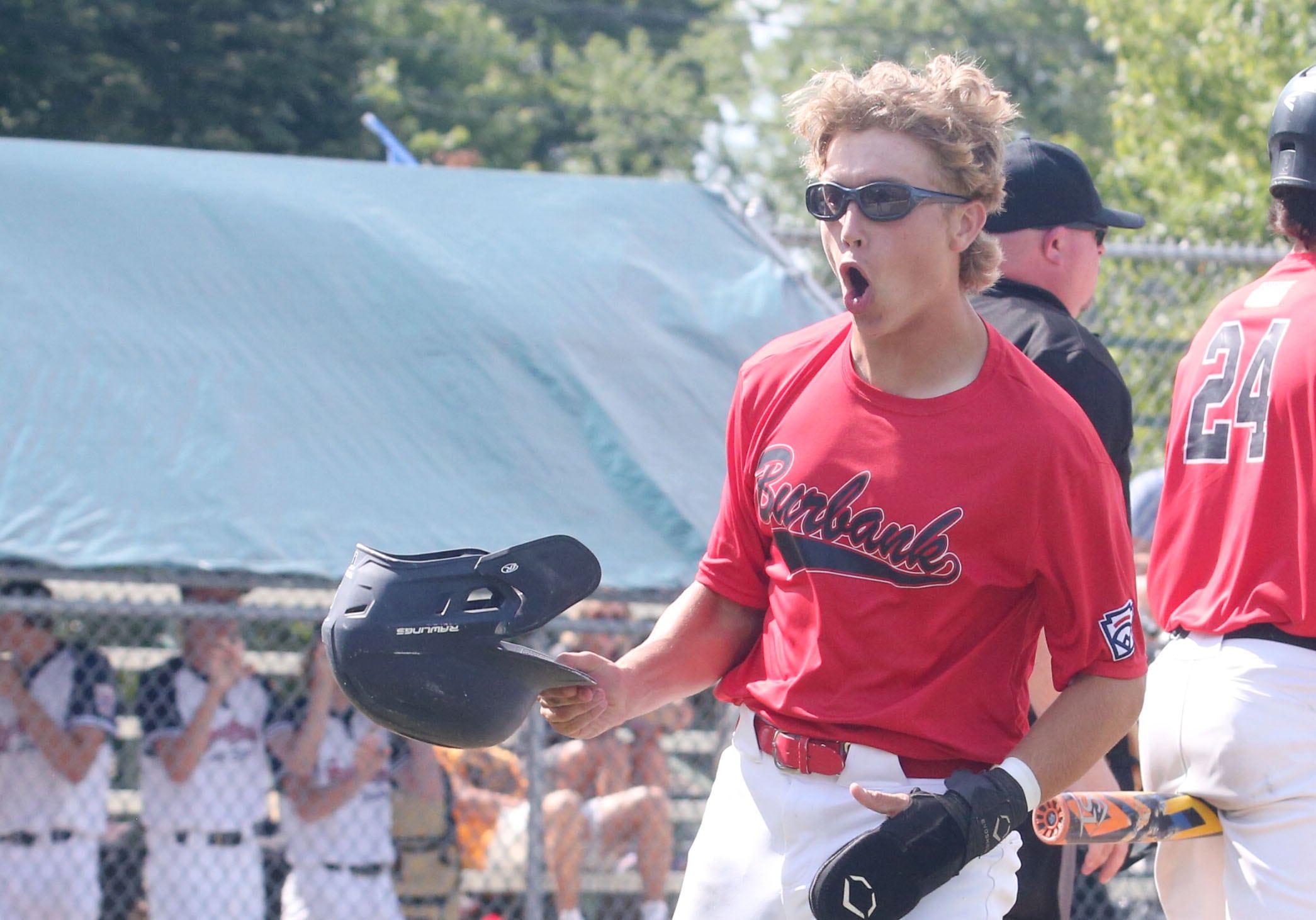 Burbank's Blake Stefanek reacts after scoring a run against Michigan during the Central Regional Baseball Tournament championship on Thursday, July 18, 2024 at J.A. Happ Field in Washington Park in Peru.