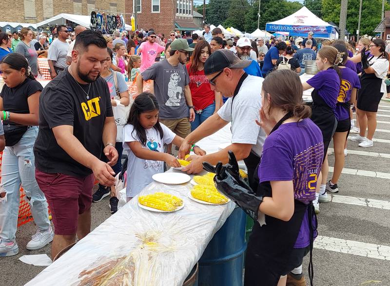 Free sweet corn is handed out Sunday, Aug. 13, 2023, during the Mendota Sweet Corn Festival.