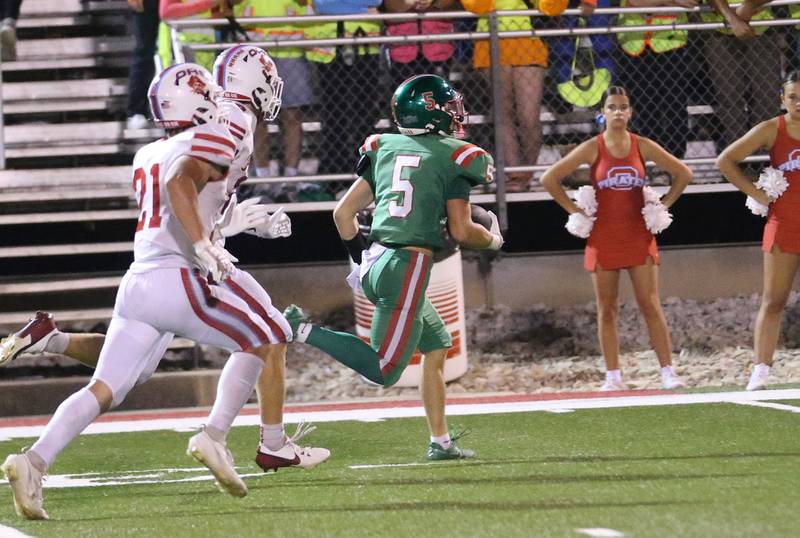 L-P's Brevyn Vogel sprints down the field past Ottawa's Jace Veith and Weston Averkamp to score a touchdown on Friday, Sept. 13, 2024 at Howard Fellows Stadium.