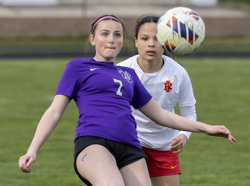 Dixon’s Madeline McLane eyes the ball against Rock Island’s Man Nuam Friday, April 12, 2024.